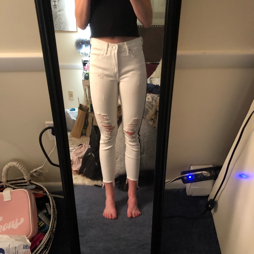 Express white jeans with rip and blue stripe